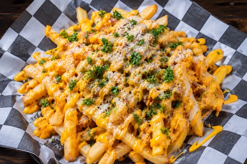 Cheese Fries topped with melted cheese and parsley