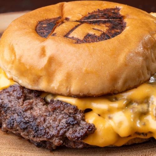 Smashed Classic Burger with melted cheese and green aji sauce